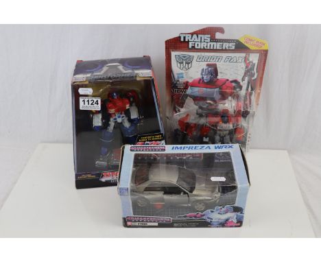Boxed Hasbro Transformers Titanium Series Die-Cast Optimus Prime, boxed Hasbro Generations Orion Pax Autobot IDW Comic Pack a
