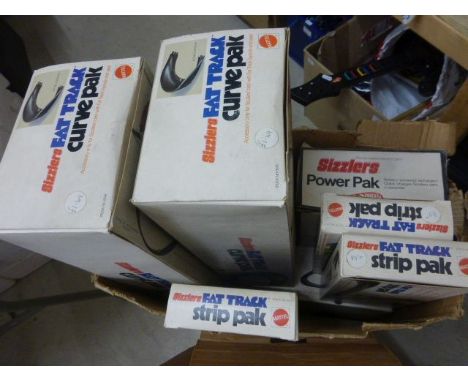 Collection of vintage Mattel Hot Wheels Sizzlers Fat Track and racing accessories to include 10 boxed track packs featuring C