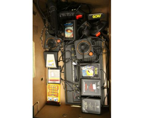 Atari games console, with 3 joysticks and 7 games, Space Invaders, Dragonfire, Pac-Man etc. Sold with a Texas Instruments Lit