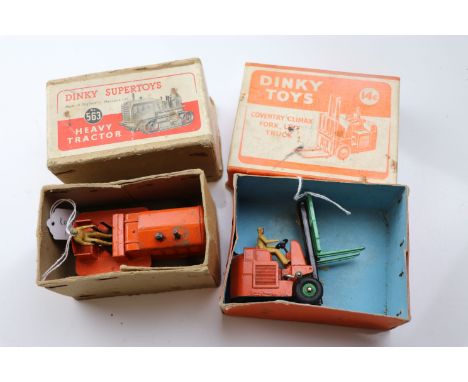 Boxed Dinky 14C Coventry Climax Fork Lift Truck and a boxed Dinky Supertoys 563 Heavy Tractor in orange, both showing play we
