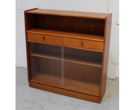 A retro-style bookcase with single shelf above two short drawers, above single-shelf interior enclosed by two sliding glass d