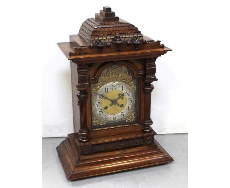 A late 19th century walnut-cased eight-day bracket clock.   CONDITION REPORT  The door panel is 21.5 x 16cm.The dial plate is