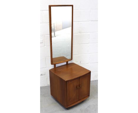 An Ercol dressing mirror raised on single-shelf cabinet, height approx 146cm.