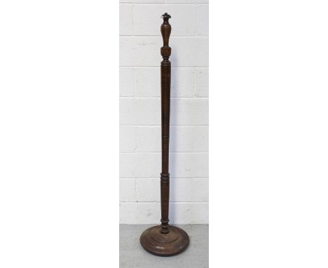 An oak standard lamp, height approx 151cm.