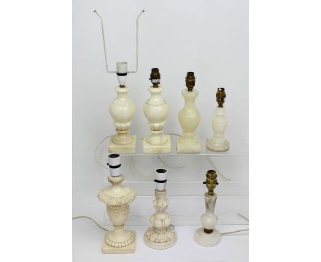 A pair of alabaster table lamps, three smaller similar examples, two plaster table lamps and one small table lamp (7).