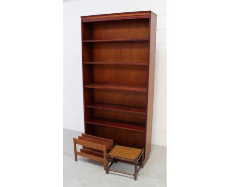 A mahogany four-shelf bookcase, a Lloyd Loom style basket, a small stool with cane seat and a magazine rack (4).