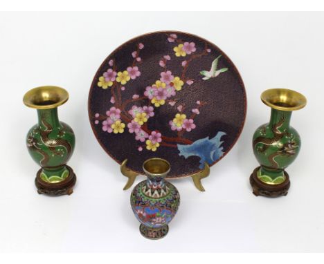 A pair of Japanese cloisonné enamel green ground baluster vases, with dragon and Flaming Pearl decoration, with flared gilt r