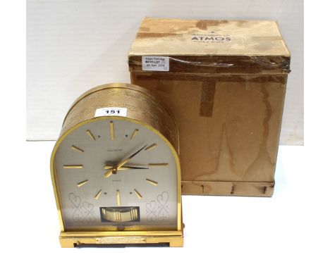 Jaeger-LeCoultre; a cased 'Atmos Bourne' model mantel clock, the dial set with gilt baton numerals and with presentation plaq