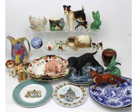 A collection of pottery animals to include a Coopercraft Labrador and one other Coopercraft dog, a Beswick fox, a large Beswi