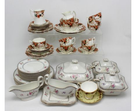 A set of Wedgwood floral-decorated tableware including five graduated oval platters, four lidded dishes, two sauce boats, din