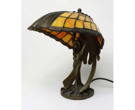 An Art Nouveau style metal table lamp with Tiffany-style glass shade, height approx 30cm.