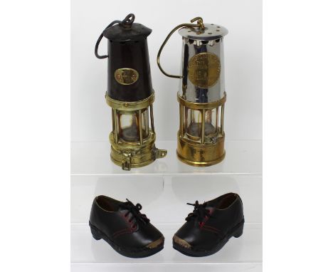 Two miners' lamps, one by Naylor of Wigan, numbered plaque 'SH530' and 'The Protector Lamp and Lighting Co Ltd of Eccles' Typ