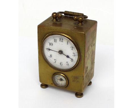 A small French brass travel alarm clock with porcelain face set with Arabic numerals and subsidiary alarm dial (each dial af)