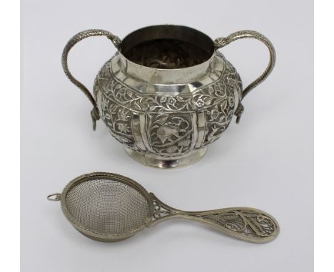 An Indian silver twin-handled basin and a Continental silver sifter with filigree handle, combined approx 6.7ozt (2).