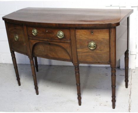 A 19th century mahogany bow-front sideboard, two central frieze drawers with cupboard door to either side, on ring-turned sup