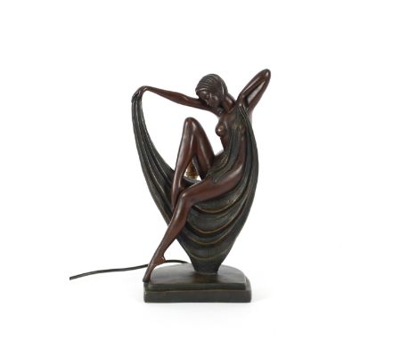 An Art Deco style figural lamp base, in the form of a semi-naked seated girl, 14.5cm high
