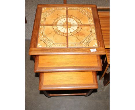 A nest of three G-plan design teak and tile top coffee tables