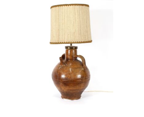 A large table lamp, the base in the form of an old earthenware olive oil bottle, 95cm high overall