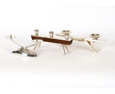 A W.M.F. plated twin branch pricket candlestick; another W.M.F. twin sconce candle holder; and a Bauhaus design three light c