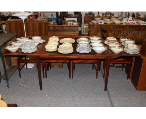 A McIntosh extending rosewood dining table, 236cm x 92cm, and a set of eight matching ladder back chairs, (with Cites certifi