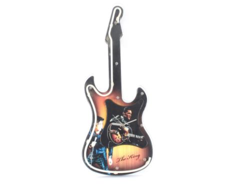 An "Elvisly Yours" illuminating guitar shaped clock