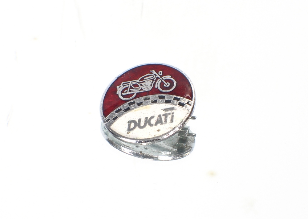 A Ducati enamel motorcycle badge