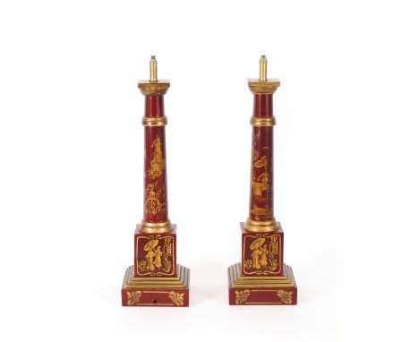 A pair of chinoiserie decorated red and gilt lamp bases, 54cm high