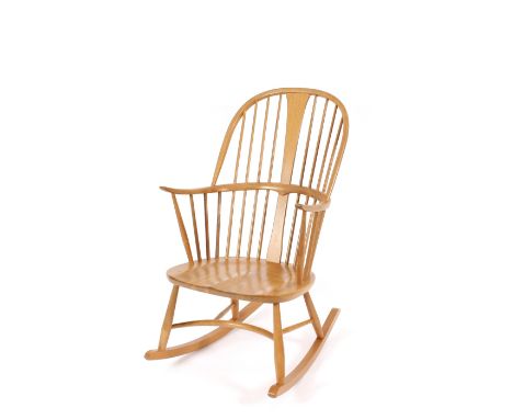 An blonde Ercol stick back rocking chair 