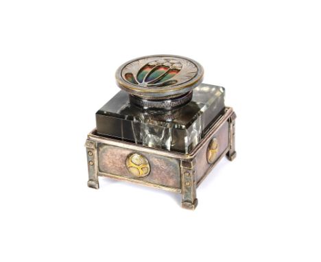 A Liberty's style Art Deco plated and enamel decorated block glass ink well, 8cm high