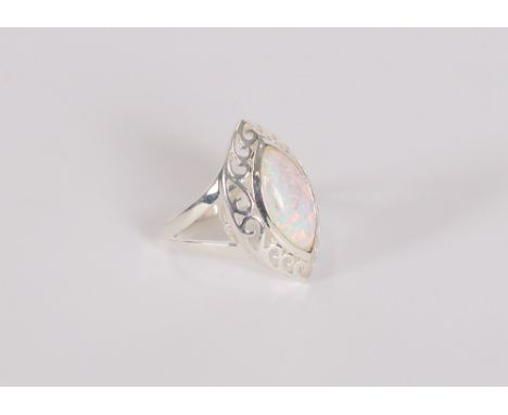 A white metal and opal set dress ring