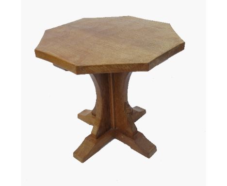 An octagonal top oak table, with quatrefoil column, terminating in sledge feet, by Robert 'Mouseman' Thompson of Kilburn, dia