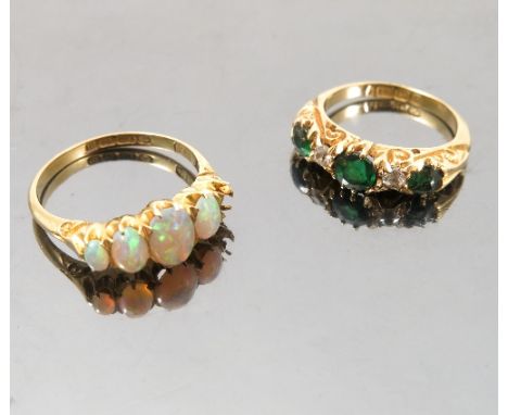 A green doublet and diamond 18ct gold ring, finger size G 1/2, weight 3.7g gross, and an 18ct gold opal ring with one setting