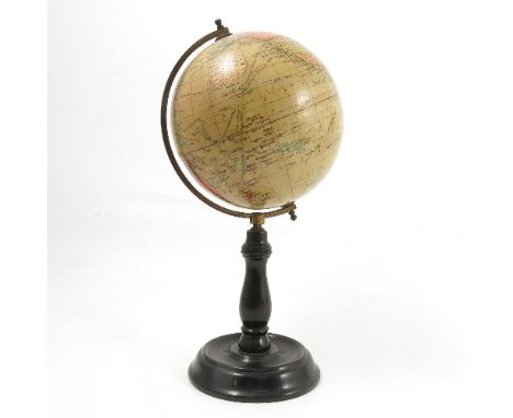 A Geographia 6 inch Terrestrial Globe, by Geographia Ltd London, on an ebonised turned wooden stand, height 13ins