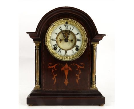 An Ansonia Clock Co. New York mahogany cased mantel clock, with enamel chapter ring and Roman numerals, chiming movement, set