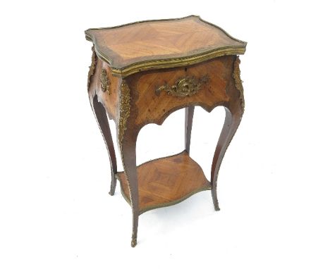 A 19th century Kingwood work table, with quadrant serpentine front and cross banded and quarter veneered top, with rising lid