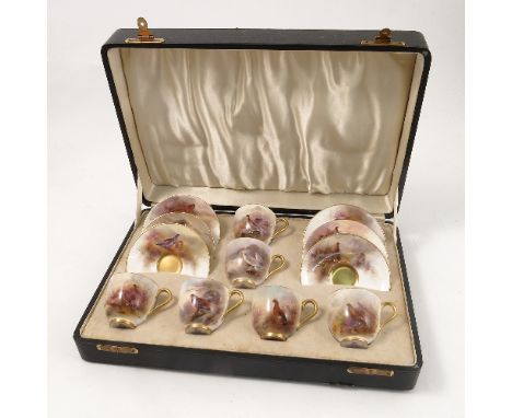 A cased set of six Royal Worcester cups and saucers, being decorated to the exterior of the cups and saucers with grouse, par