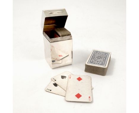 A hallmarked silver card case, of oblong form, the rising lid opening to reveal two compartments, with two sets of playing ca