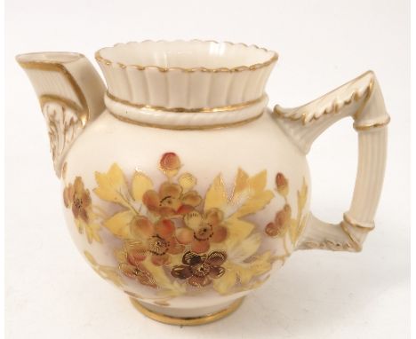 A Royal Worcester gilded ivory chocolate jug, decorated with shot silk gilded flowers, circa 1872, height 3.5ins 