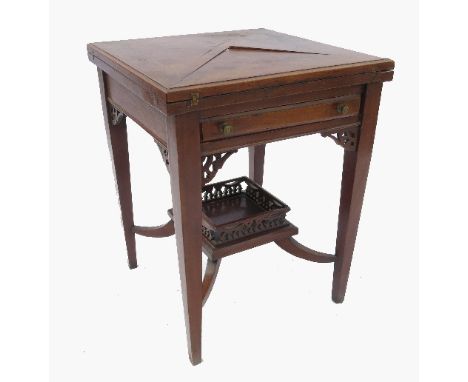 An Edwardian mahogany envelope table, raised on four legs united by a plant shelf