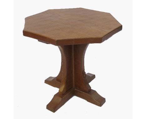 An octagonal top oak table, with quatrefoil column, terminating in sledge feet, by Robert 'Mouseman' Thompson of Kilburn, dia