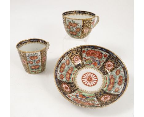 A Chamberlains Worcester trio set, comprising coffee can, teacup and saucer, decorated in the rich Queens pattern Condition r