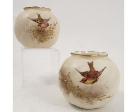 Two Royal China Works Worcester vases, the wrythen moulded bodies decorated with tits to a gilded ivory ground, with gilded s