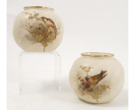 Two Royal China Works Worcester vases, the wrythen moulded bodies decorated with tits to a gilded ivory ground, with gilded s