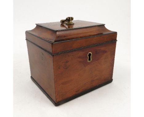A Georgian walnut tea caddy, of square form with stepped lid, having ebonised bands, with brass handle to the cover, the inte