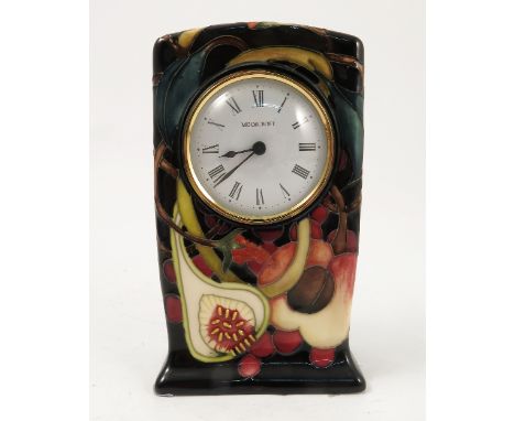 A modern Moorcroft Pottery mantel clock, decorated in the Queens Choice pattern, boxed, height 6.25ins Condition report: good
