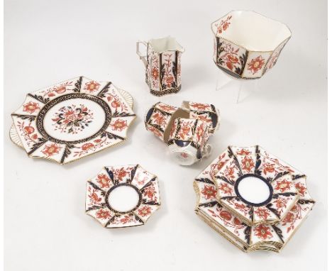 A 19th century Wileman Shelley part tea service, comprising cake plate, four side plates, four saucers, three cups, milk jug 