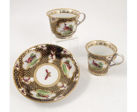 A Chamberlains Worcester trio set, comprising coffee can, teacup and saucer, decorated in underglaze blues, with gilt scale d