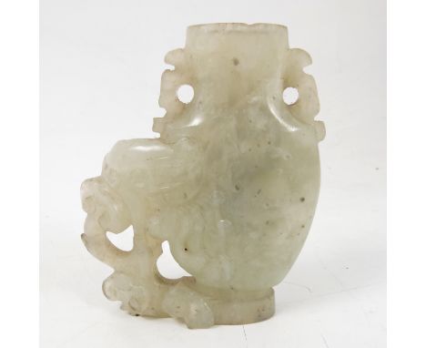 A carved hardstone vase, possibly white jade, of a stylized elephant and foliage, height 3.5ins 