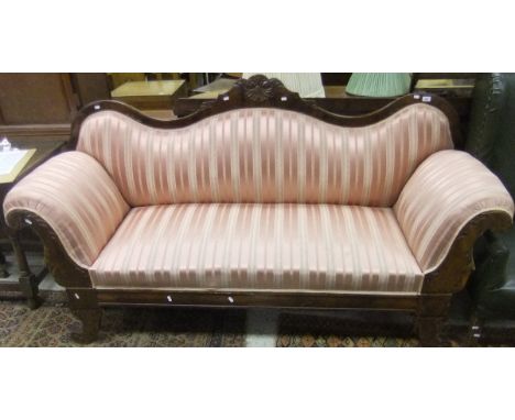 A 19th Century mahogany show frame scroll arm sofa on scroll feet