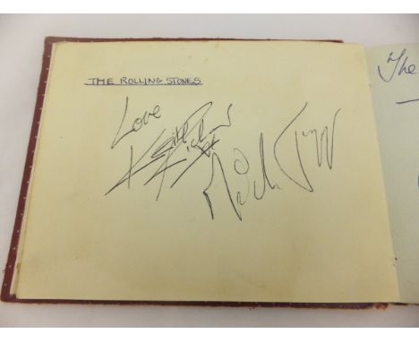 An autograph album containing signatures of Brian Jones, Keith Richards and Mick Jagger of The Rolling Stones, The Mersey Bea